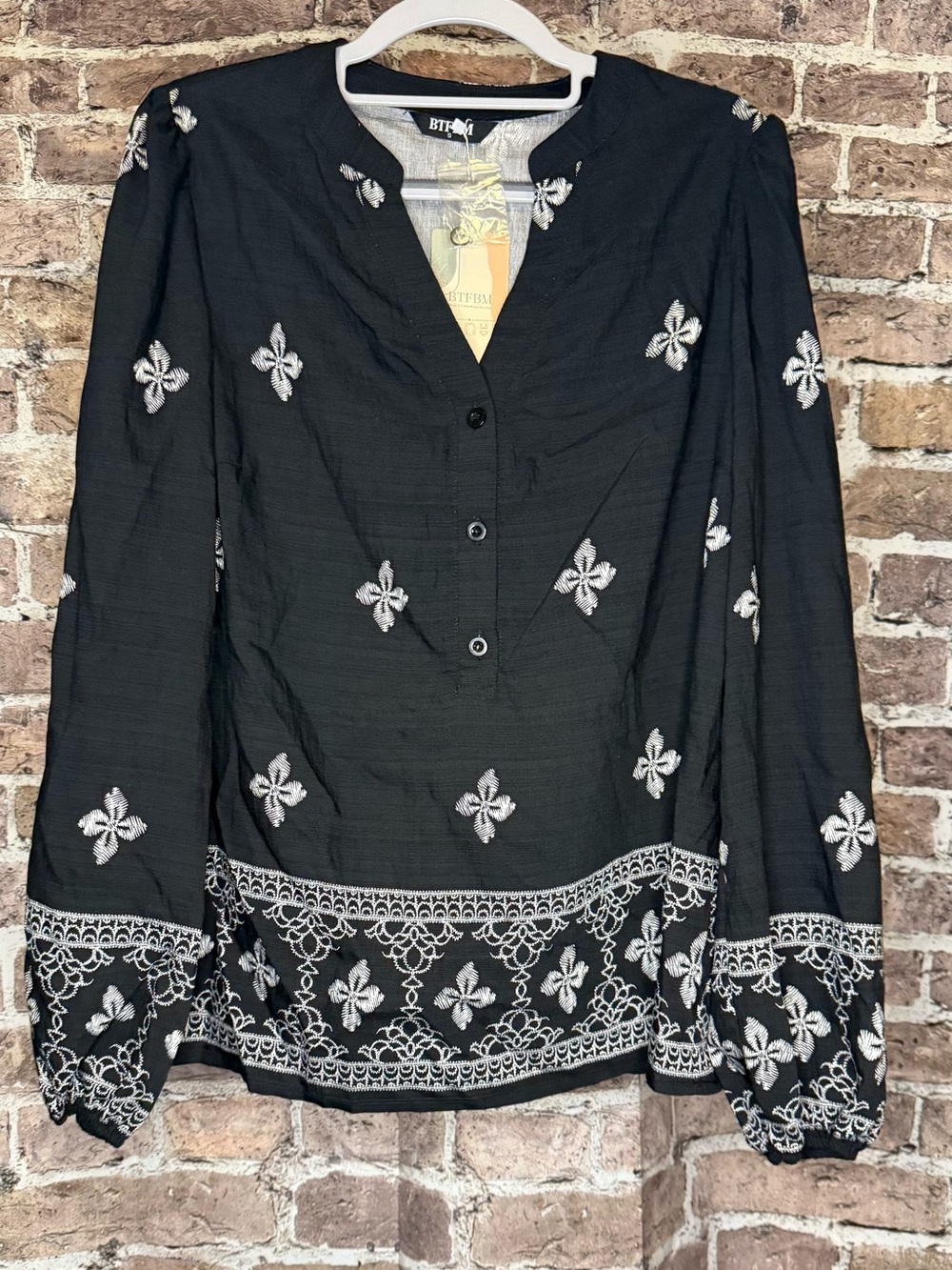 Black Long-Sleeve Women's Top With White Accent Pattern